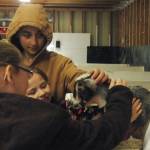4-H club member Kellee Martin (right) holds up her baby Nigerian dwarf goat for visitors to pet at the Kenai Peninsula Fair on Saturday, Aug. 18, 2018 in Ninilchik, Alaska. (Photo by Elizabeth Earl/Peninsula Clarion)