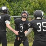 Nikiski junior Sam Berry (3) lets out a roar of celebration after scoring a touchdown early Saturday against Valdez at Nikiski High School. (Photo by Joey Klecka/Peninsula Clarion)