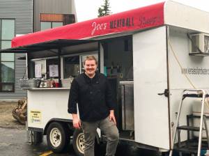 Joe Spady stands in front of his food truck, Joes Meatball Shoppe, on Sunday, Aug. 26, 2018, in Soldotna, Alaska. Spady rents his truck through Kenai Soil and Water Conservation District, who offers the converted trailer for people interested in a test kitchen and small business development, with a focus on Alaska grown products. (Photo by Victoria Petersen/Peninsula Clarion)