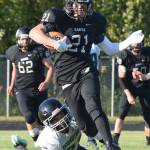 Nikiski senior Brock Sarks (21) cuts through a field of Redington defenders Friday against the Redington Huskies at Nikiski High School. (Photo by Joey Klecka/Peninsula Clarion)