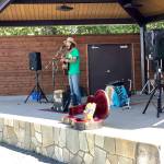 Musician Mika Day performs for market attendees at this years final Wednesday Market on Wednesday, Aug. 29, 2018, in Soldotna, Alaska. (Photo by Victoria Petersen/Peninsula Clarion)