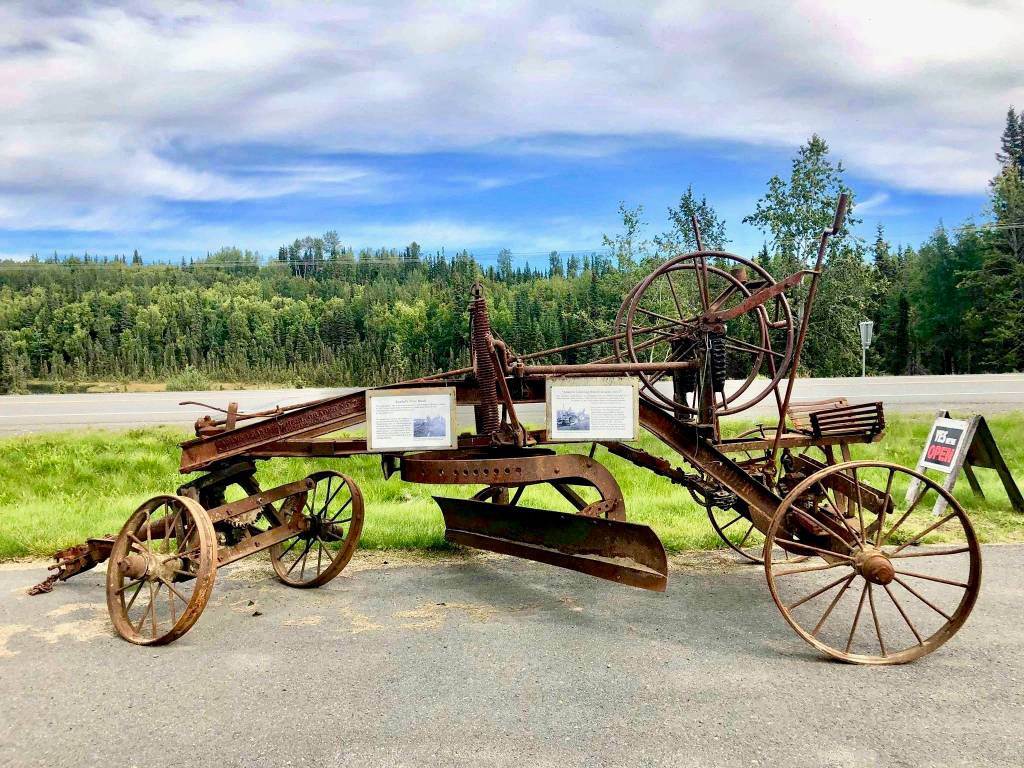 Adams leaning wheel grader is the first thing drivers see from the road when passing by the Kasilof Historical Museum on Wednesday, Aug. 29, 2018, in Kasilof, Alaska. (Photo by Victoria Petersen/Peninsula Clarion)