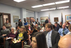In this March 4, 2015 photo, a large audience assembles at the state Capitol to hear a Lunch and Learn presentation on Medicaid expansion, including state legislators, aides and others, in Juneau, Alaska.