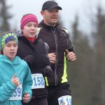 Logan Satathite (left) runs with Brooke Satathite and Sam Satathite in the Tsalteshi Trails Turkey Trot 10-kilometer race on Friday, Nov. 27 near the Soldtona Sports Center.