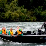 A worker cleans a salmon caught in the Kenai River Sportfishing Association’s Junior Classic event Wednesday, Aug. 10 in Soldotna, Alaska. The event gave 85 kids from Soldotna, Kenai, Anchorage and elsewhere a chance to fish for silvers and pinks.