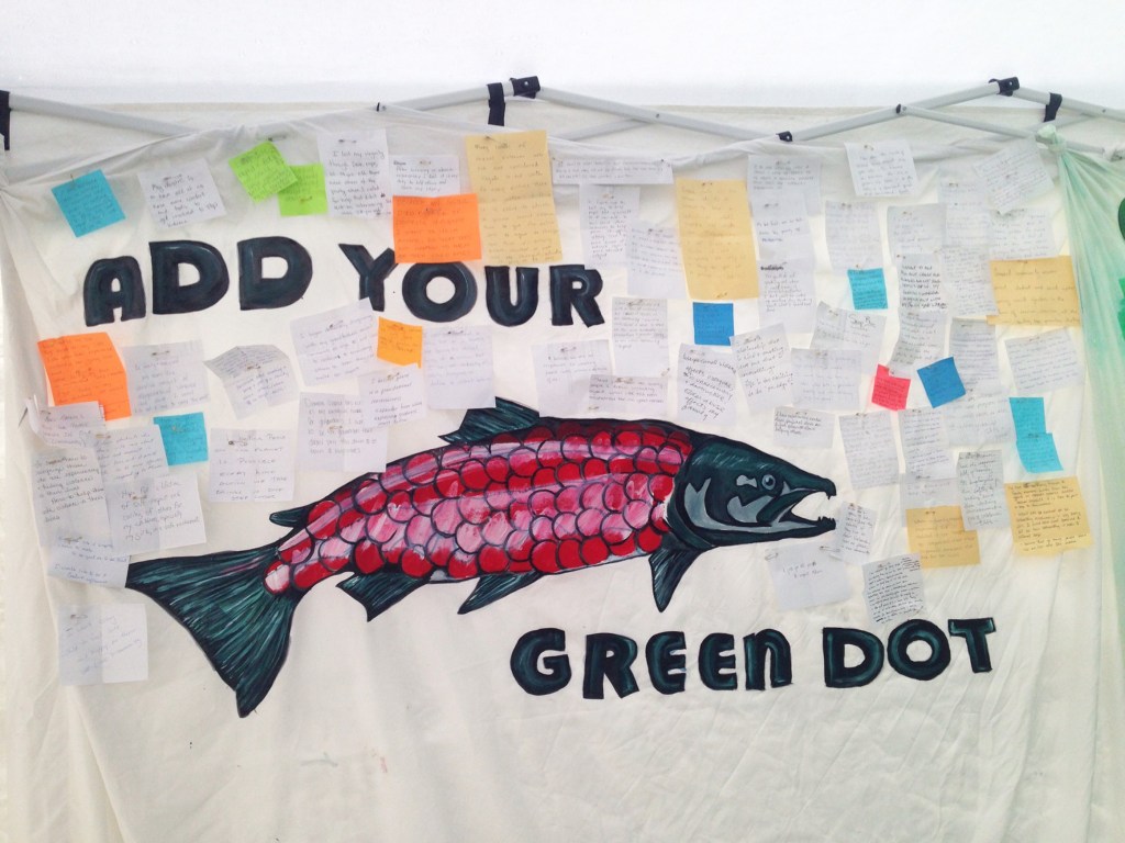 Photo by Anna Frost/Homer News Participants in Salmonfest's King Sam parade carry a giant salmon puppet throughout the festival grounds, followed by a procession of people celebrating the fish Saturday, Aug. 6, 2016 in Ninilchik, Alaska.