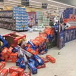 Joseph Gottschalk, 12, and Soldotna resident Renee Duncan play a board game while waiting in a temporary shelter after people were evacuated from their homes along Lilac Lane on Sunday, Jan. 24, 2016 in Kenai, Alaska. A 7.1 magnitude earthquake caused several gas explosions in homes on Lilac Lane, and residents were evacuated to the Kenai National Guard Armory.