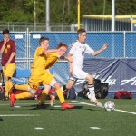 Kenai senior Austin McKee plays the ball forward in the second half of Friday's state soccer semifinal at Bartlett High in Anchorage. Dimond won 3-0.