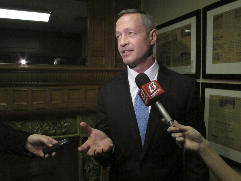 Former Maryland Gov. Martin O'Malley discusses economic issues with reporters before speaking to a banquet at Kansas Democrats' biggest annual convention, Saturday, March 7, 2015, in Topeka, Kan.
