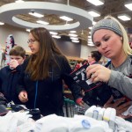 Clarion Caitlin Coreson, of Kenai, looks at home decorations at Northcountry Fair, 35802 Kenai Spur Highway, on Black Friday Nov. 27, 2015 in Soldotna, Alaska.