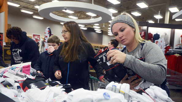Clarion Caitlin Coreson, of Kenai, looks at home decorations at Northcountry Fair, 35802 Kenai Spur Highway, on Black Friday Nov. 27, 2015 in Soldotna, Alaska.