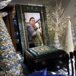 Rose LaHatt checks out a sweater rack as her son Maverick LaHatt looks on during Black Friday shopping on Friday Nov. 27, 2015 in Soldotna, Alaska. The LaHatts, of Nikiski, were at the Fred Meyer grocery store in Soldotna shopping at about 5 a.m.