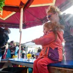 A group laughs while riding the Cliff Hanger on Sunday June 7, 2015 at the Goldwen Wheel Amusements Carnival in Kenai, Alaska.