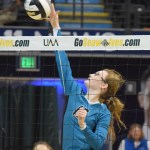 Seward libero Kimmie Hubbard (in pink) digs for a ball with teammate Tia Miranda, Friday against Monroe Catholic in the Class 3A state volleyball tournament held at the Alaska Airlines Arena in Anchorage.