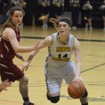 Homer senior Madison Akers works to shake loose Mt. Edgecumbe defender Payton Weisz in Friday's Class 3A state semifinal at the Alaska Airlines Center in Anchorage.