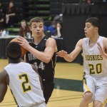 Nikiski senior Hunter Holloway moves in for a layup against Delta Junction in Friday's Class 3A boys state tournament consolation semifinal contest at the Alaska Airlines Center in Anchorage.