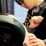 Sandra Groller gets a massage from Caitlin Sparks, the owner of Kenai Peninsula Massage Therapy, at the Project Homeless Connect event at the Soldotna Regional Sports Complex on Tuesday, Jan. 24, 2017 in Soldotna, Alaska. Sparks, who shared a booth with Heather Rasch of Mountain Magic Massage, was one of 34 providing services to those experiencing homelessness or near homelessness at the event, now in its 6th year. By noon, vendors said things had started off a little slow but were beginning to pick up, and some who had been there multiple years said they were seeing some new faces. Services included haircuts, massages, blood pressure checks, job searches and hot meals, among others, all for free. Attendees could get taxi rides to the event, pick up free coats, boots, hats and food to take home. (Elizabeth Earl/Peninsula Clarion)