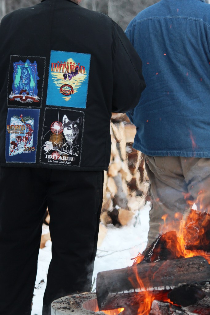Musher Mitch Seavey pets one of his sled dogs after crossing the finish line of the Tustumena 200 Sled Dog Race on Sunday, Jan. 29, 2017 in Kasilof, Alaska. Seavey, who won the 200-mile race through the Caribou Hills in 2013, came in fourth in 26 hours and 50 minutes. (Megan Pacer/Peninsula Clarion)
