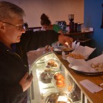 Jeff Warton samples three flavors of bagel spread at the grand opening of the Kenai location of Everything Bagels on Tuesday, Jan. 31,2017 in Kenai, Alaska. The grand opening comes 13 days after the Kenai shop had its soft opening on Jan. 18, seven months after Everything Bagels opened its first location in Soldotna on July 15, 2016, and on the one-year anniversary of co-owners Matt and Pamela Parker (with Brooke and John Campbell) making their first batch of bagels in their home kitchen, Pamela Parker said. "We came from Florida, where all the New Yorkers go to retire, so there's tons of delicious bagels there," she said. "We wanted to bring that up here." (Ben Boettger/Peninsula Clarion)
