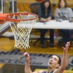 Soldotna&rsquo;s Derek Evans soars for a rebound Tuesday, Jan. 31, 2017, at Nikiski High School. (Photo by Jeff Helminiak/Peninsula Clarion)