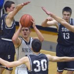Nikiski&rsquo;s Ian Johnson extracts himself from a maze of defenders Tuesday, Jan. 31, 2017, at Nikiski High School. From left are Caleb Spence, Sam McElroy, Eli Sheridan and Derek Evans. (Photo by Jeff Helminiak/Peninsula Clarion)