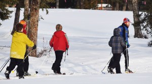Ski coach Darin Markwart (far right) leads a group of Tsalteshi Youth skiers, Jan. 28 at the Kenai Golf Course. (Photo by Joey Klecka/Peninsula Clarion)