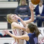 Juneau-Douglas&rsquo; Georgia Robinson, left, is fouled by Soldotna&rsquo;s Aliann Schmidt while attempting a shot at Juneau-Douglas High School on Friday, Feb. 3, 2017. JDHS won 48-46. (Photo by Michael Penn/Juneau Empire)