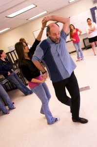 Eddie Wood, of Homer, demonstrates dance steps with Stephanie Almaraz in a Spanish class on May 5, 2008 at Soldotna High School. Wood, who travels the peninsula playing percussion and teaching salsa, is hosting his first open class for adults in Soldotna with local artist Kaitlin Vadla on Thursday. (Scott Moon/Peninsula Clarion-File)