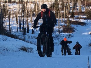 Mike Crawford of Kenai leads a group of fat tire bikers up a climb in the Caribou Hills in January. A fat tire race and ride is planned for Sunday starting at Freddie&rsquo;s Road House on Oil Well Road near Ninilchik. (Clarion file photo)
