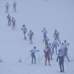 The boys varsity field at the Kenai Klassic snakes its way up a hill Friday, Jan. 20, at the snowy Kenai Golf Course. (Photo by Joey Klecka/Peninsula Clarion)