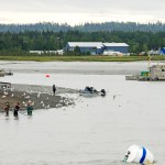 In this June 2016 photo, dipnetters, commercial fishing vessels and seagulls all crowd the mouth of the Kasilof River at low tide in Kasilof, Alaska. (Elizabeth Earl/Peninsula Clarion, file)