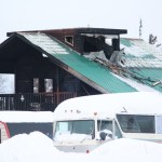 The charred remains of a three-story home stand just off Bridge Access Road after a fire Wednesday, Feb. 22, 2017 in Kenai, Alaska. No one was hurt in the residential fire that required a portion of the road to be closed that afternoon. (Megan Pacer/Peninsula Clarion)