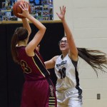 Nikiski senior Ayla Pitt defends Grace Christian&rsquo;s Makenna Shamburger, Friday night at Nikiski High School. (Photo by Joey Klecka/Peninsula Clarion)