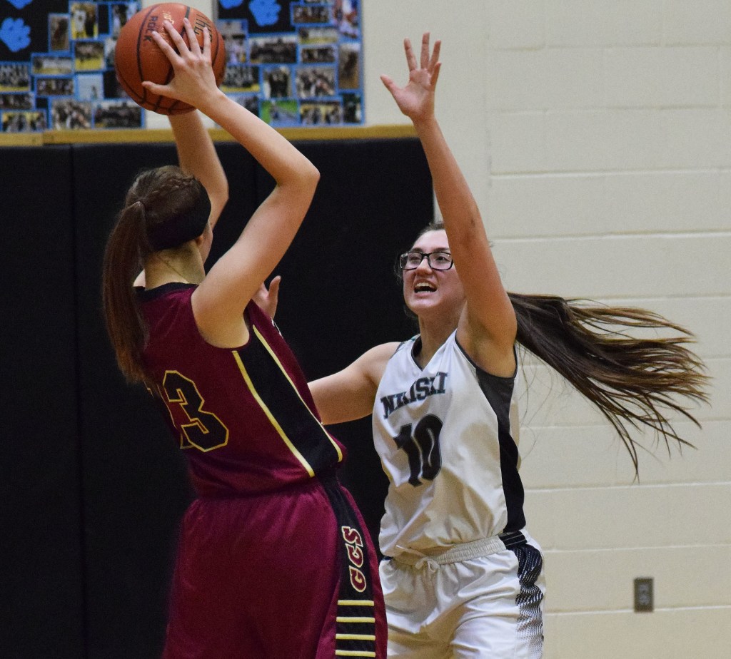 Nikiski senior Ayla Pitt defends Grace Christian&rsquo;s Makenna Shamburger, Friday night at Nikiski High School. (Photo by Joey Klecka/Peninsula Clarion)