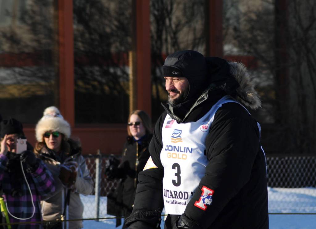 Musher Otto Balogh makes his way down the trail along 4th Avenue for the ceremonial start of the 45th Iditarod race on Saturday, March 4, 2017 in Anchorage, Alaska. Balogh, of Budapest, Hungary, is a rookie musher. (Elizabeth Earl/Peninsula Clarion)