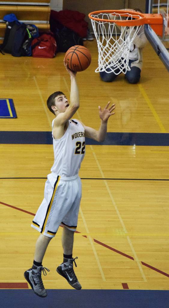 Matt Bartolowits of Ninilchik breaks free for an open layup in the first half of Friday&rsquo;s Peninsula Conference boys championship game at Homer High School. (Photo by Joey Klecka/Peninsula Clarion)
