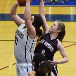 Nikolaevsk&rsquo;s Kristin Klaich (right) puts a block on Ninilchik&rsquo;s Mikayla Clark in Friday&rsquo;s Peninsula Conference girls championship game at Homer High School. (Photo by Joey Klecka/Peninsula Clarion)