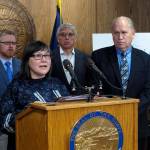 Alaska state health commissioner Valerie Davidson speaks during a news conference on Monday, March 6, 2017, in Juneau, Alaska, during which Alaska Gov. Bill Walker outlined legislation aimed at further addressing opioid abuse in Alaska. Also shown, from left, are Walker chief of staff Scott Kendall, Lt. Gov. Byron Mallott and Walker. (AP Photo/Becky Bohrer)