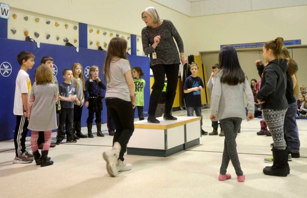 Artist in Residence Elizabeth Ware plays the role of Tatiana in Shakespeare&rsquo;s &ldquo;A Midsummer Night&rsquo;s Dream,&rdquo; while first-grade students from Kaleidoscope School of Arts and Science acted as faeries on Thursday as the culmination of Ware&rsquo;s work with the students. (Photos by Kat Sorensen/Peninsula Clarion)