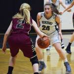 Nikiski&rsquo;s Kelsey Clark (24) eyes Grace Christian&rsquo;s Annie VanderWeide in Friday&rsquo;s semifinal at the Southcentral Conference basketball tournament at Nikiski High School. (Photo by Joey Klecka/Peninsula Clarion)