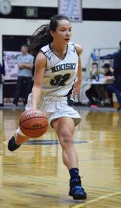 Nikiski&rsquo;s Rylee Jackson dribbles down the court Friday against Grace Christian at the Southcentral Conference basketball tournament at Nikiski High School. (Photo by Joey Klecka/Peninsula Clarion)