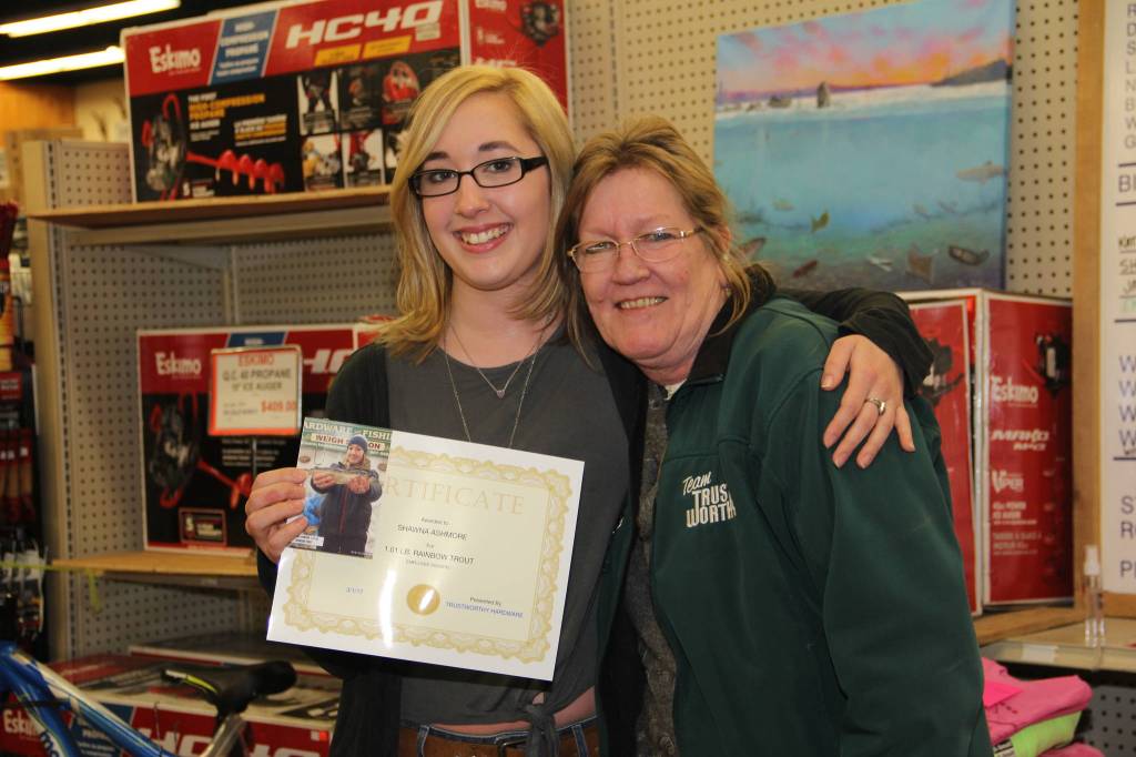 Shawna Ashmore wins the employee division with a 1.1-pound rainbow trout.