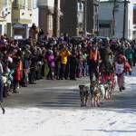 Mitch Seavey, of Sterling, Alaska, runs towards the finish line under the Burled Arch, winning the 1,000-mile Iditarod Trail Sled Dog Race, in Nome, Alaska, Tuesday, March 14, 2017. Seavey won his third Iditarod Trail Sled Dog Race on Tuesday, becoming the fastest and oldest champion at age 57 and helping cement his family&rsquo;s position as mushing royalty. (AP Photo/Diana Haecker)