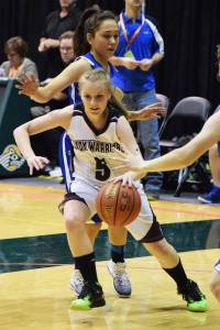 Nikolaevsk&rsquo;s Markiana Yakunin dribbles to the rim against Nunamiut, Wednesday at the Class 1A state girls tournament at the Alaska Airlines Center in Anchorage. (Photo by Joey Klecka/Peninsula Clarion)