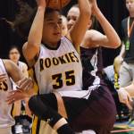 Nikolaevsk&rsquo;s Elizabeth Fefelov tangles with King Cove&rsquo;s Jalaya Duarte (35) Thursday, March 16, 2017, afternoon at the Class 1A state basketball tournament at the Alaska Airlines Center in Anchorage. (Photo by Joey Klecka/Peninsula Clarion)