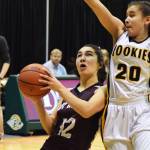 Nikolaevsk&rsquo;s Chelsea Johnson (12) dribbles to the rim against King Cove on Thursday, March 16, 2017, at the Class 1A state basketball tournament at the Alaska Airlines Center in Anchorage. (Photo by Joey Klecka/Peninsula Clarion)