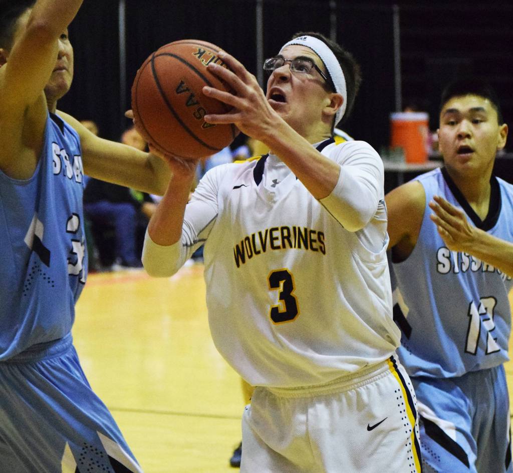 Ninilchik&rsquo;s Garrett Koch drives to the rim against Buckland on Friday, March 17, 2017, in a Class 1A state tournament semifinal held at the Alaska Airlines Center in Anchorage. (Photo by Joey Klecka/Peninsula Clarion)
