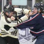 Kenai River&rsquo;s Jordan Holmes and Topeka&rsquo;s Joey Moore slug it out Friday, March 17, 2017, at the Soldotna Regional Sports Complex. (Photo by Jeff Helminiak/Peninsula Clarion)