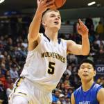 Ninilchik&rsquo;s Dalton Geppert scores against Gambell early in the Class 1A boys state championship Saturday, March 18, 2017, at the Alaska Airlines Center in Anchorage. (Photo by Joey Klecka/Peninsula Clarion)