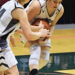 Nikiski&rsquo;s Amy Porter attempts to corrall the ball against Grace Christian in the Class 3A state quarterfinal contest Thursday, March 23, 2017, at the Alaska Airlines Center in Anchorage. (Photo by Joey Klecka/Peninsula Clarion)